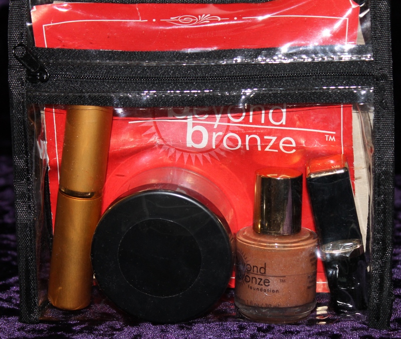 Beyond Bronze Foundation, Lip Tint, Powder, Powder Brush in clear plastic zippered pouch