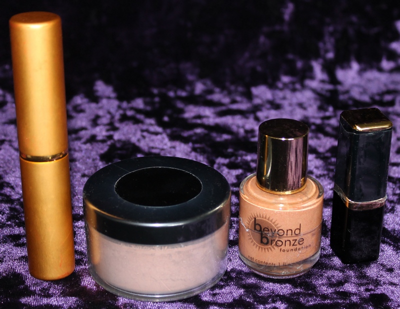 Beyond Bronze Foundation, Lip Tint, Powder, Powder Brush in clear plastic zippered pouch