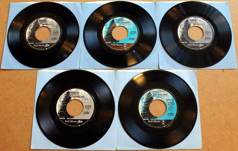 Lot of 5 Dan Fogelberg 45's in Original Sleeves Produced by Full Moon / Epic.  Titles on this side from top left to lower right: Leader of the Band 1981; Along the Road 1979; The Sand and the Foam 1981; Missing You 1982; Demo Record - Heart Hotels / Heart Hotels 1979